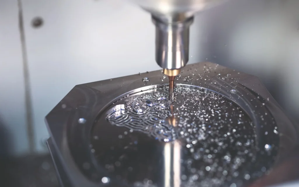 Image of a dental milling tool on a metal blank disc