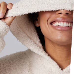 Image shows a lady smiling - Flexcera by Desktop HEalth