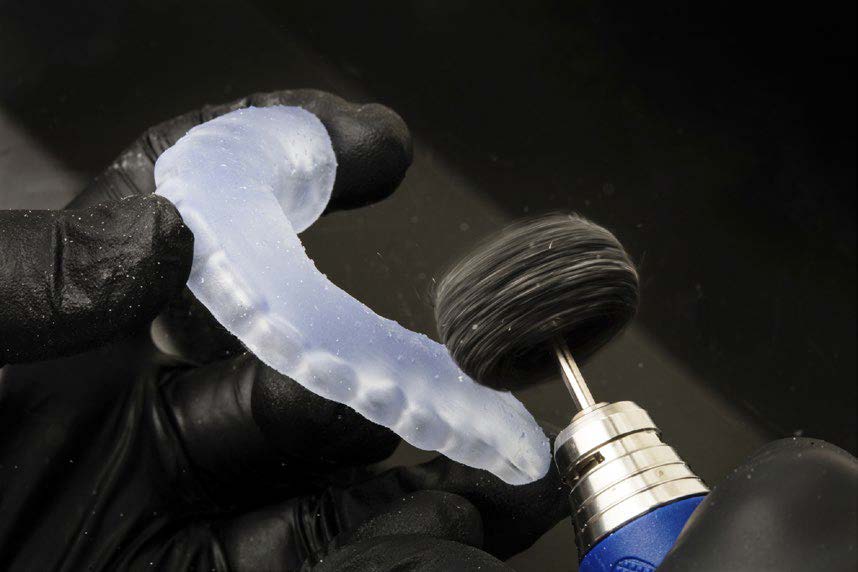 Image showing a 3D printed bite splint polished with handpiece