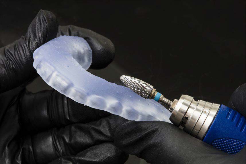 Image showing polishing a bite splint printed with SmileGuard