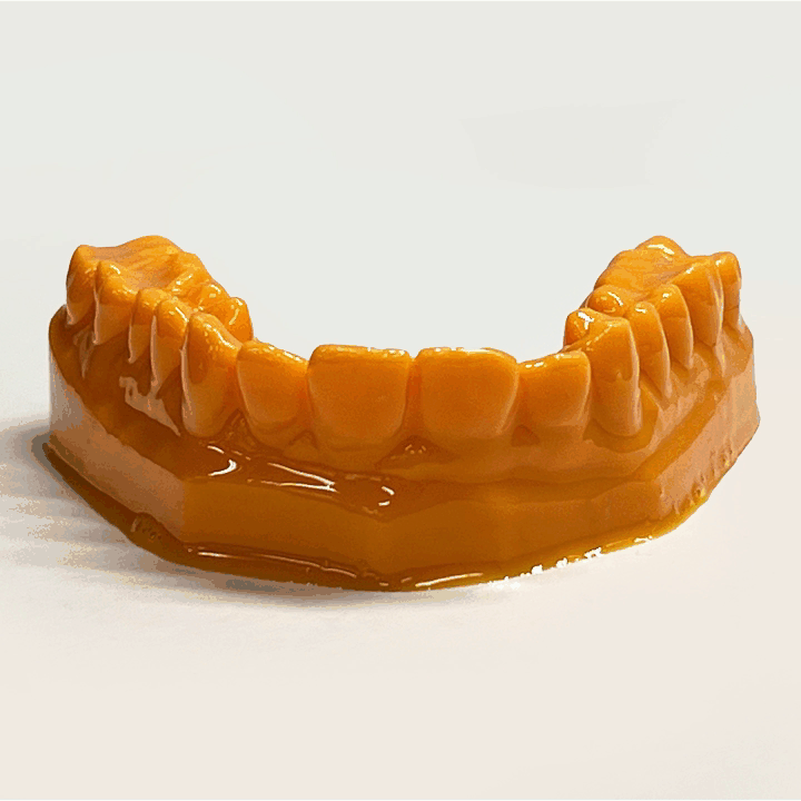 Image shows 3D-printed teeth before and after being cleaned with PostProcess DEMI machine