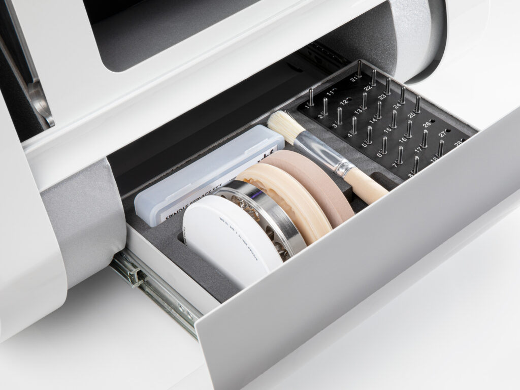 Image shows vhf's K5+ dental mill storage drawer with milling discs and tools