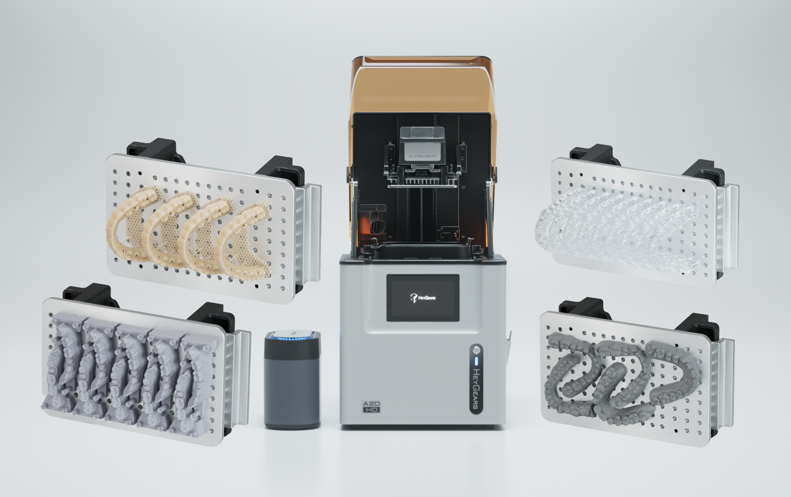 A collage image of a Heygears dental printer with 3D printed models